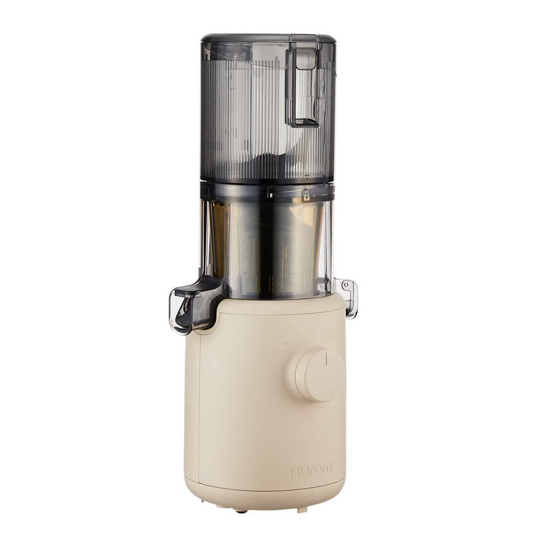 A biege Hurom H-310A Slow Juicer on a white background.